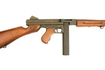 a close up of a gun with Springfield Armory in the background