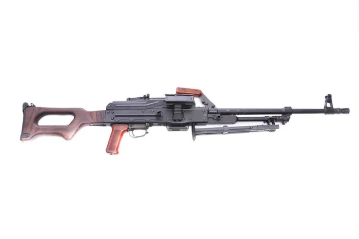 A black and brown assault rifle with a bipod on a white background.